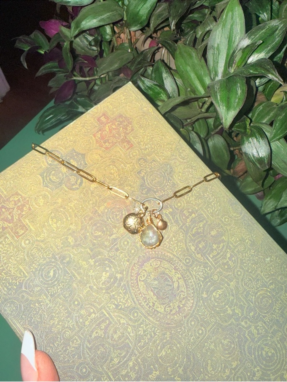 Gold Charm Pendant Necklace with Pearl and Shell Accents in show